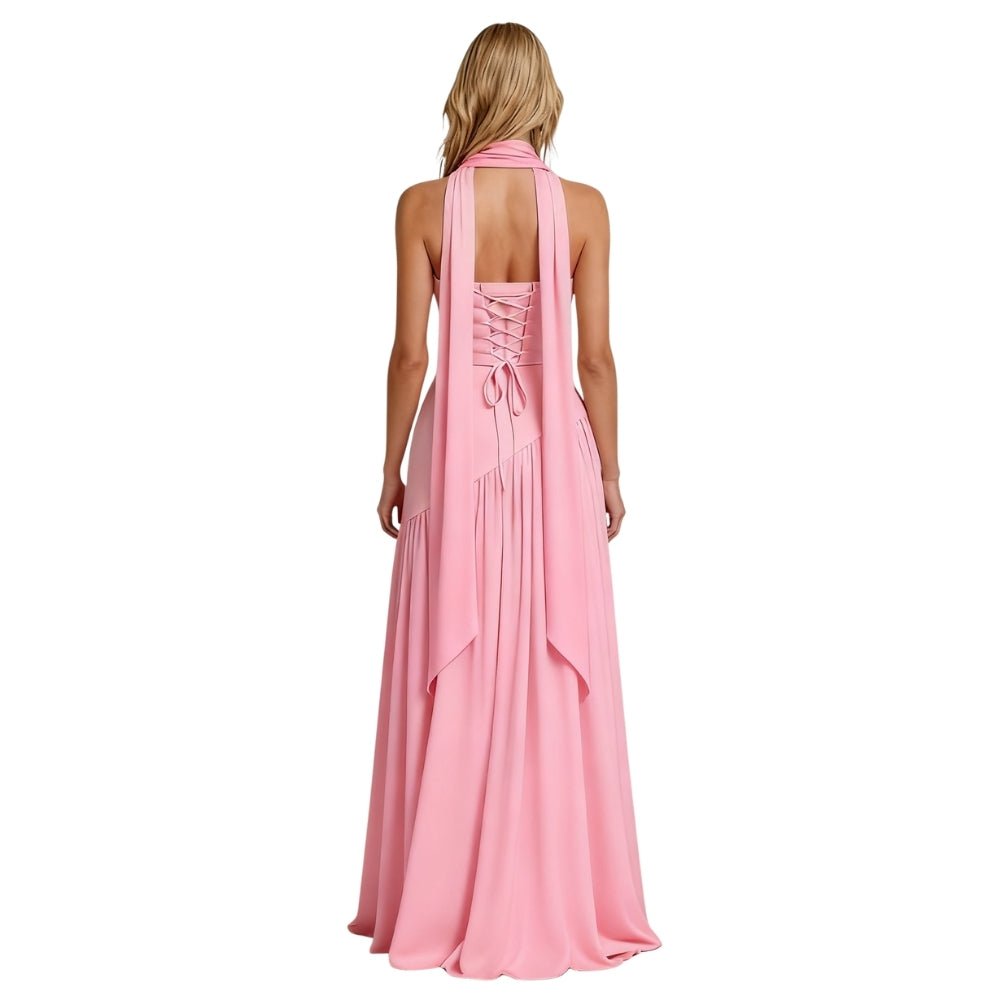 Pink Kouvr halter neck gown on a white background