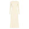 Model wearing the Kouvr Fashion long sleeve pleated knit maxi dress in cream, posing in a minimalist room