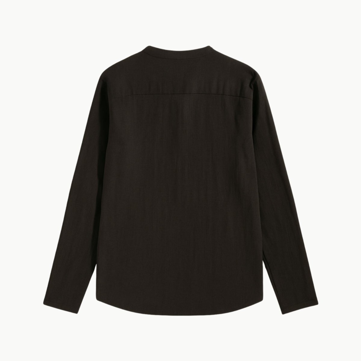 Flat lay photo of the back of a men's black long sleeve linen shirt, detailing the back yoke and clean construction.