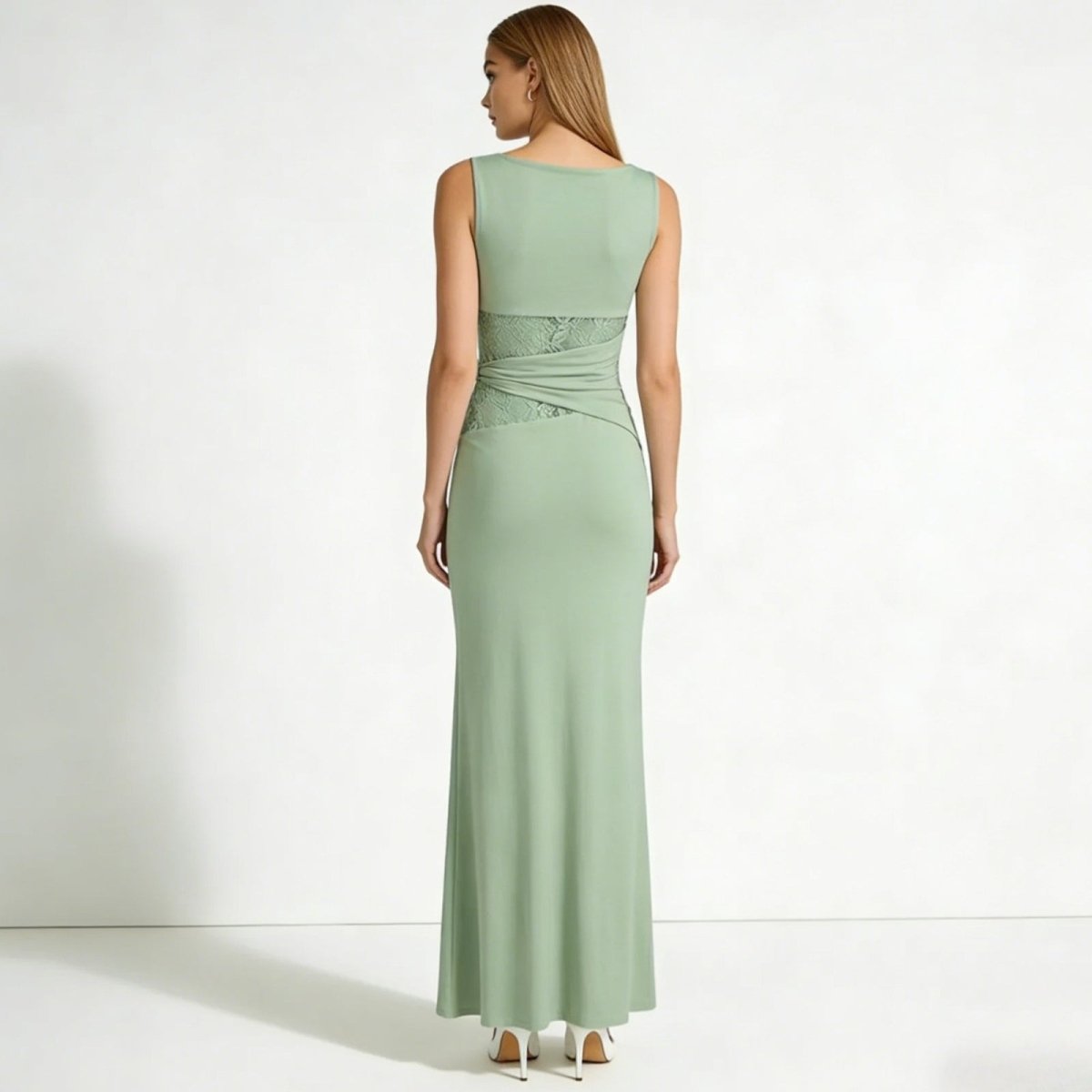 Back view of the Kouvr Fashion sage green formal dress, highlighting the boat neckline and lace wrap detail on the lower back.