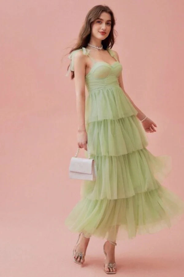 ethereal," "whimsical," "romantic," "A-line silhouette," "sweetheart neckline," "ruched," "cascading layers," "garden party," "special occasion