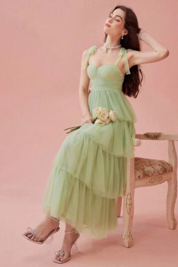 ethereal," "whimsical," "romantic," "A-line silhouette," "sweetheart neckline," "ruched," "cascading layers," "garden party," "special occasion