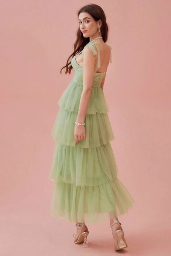 ethereal," "whimsical," "romantic," "A-line silhouette," "sweetheart neckline," "ruched," "cascading layers," "garden party," "special occasion