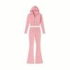 Product flatlay of the Kouvr Fashion two-piece pink knit set, including the cropped zip hoodie and flared pants, on a white background.