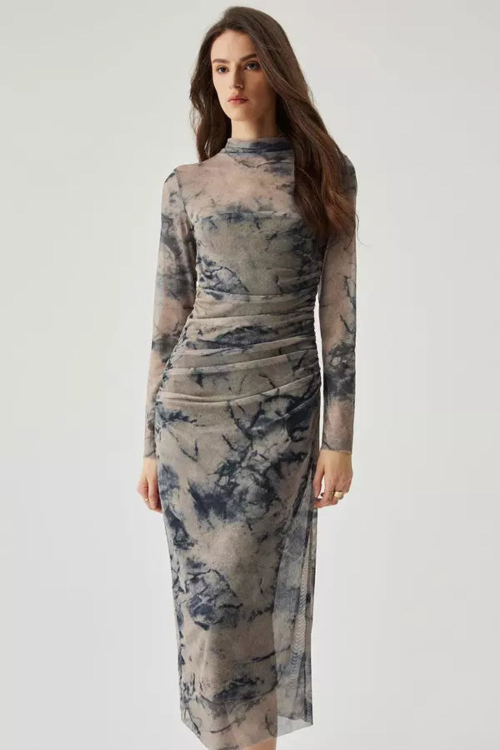 Model wearing the Kouvr Fashion long sleeve ruched mesh midi dress in a storm multicolor tie-dye print