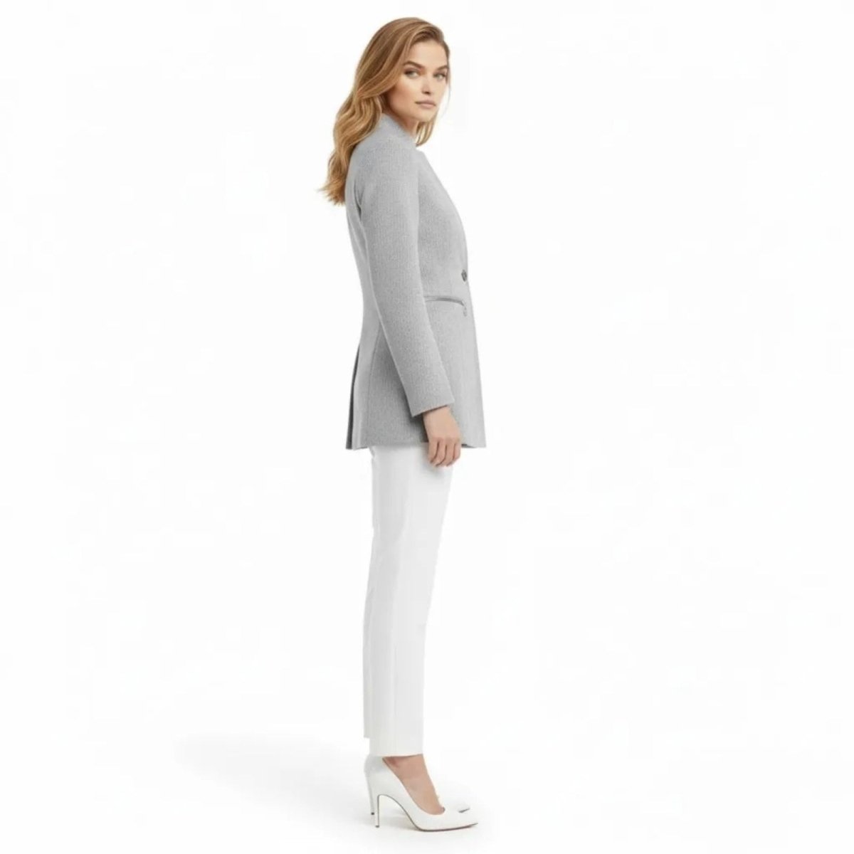 Side profile view of the longline tailored fit of the Kouvr Fashion light gray structured blazer showing its length and silhouette.