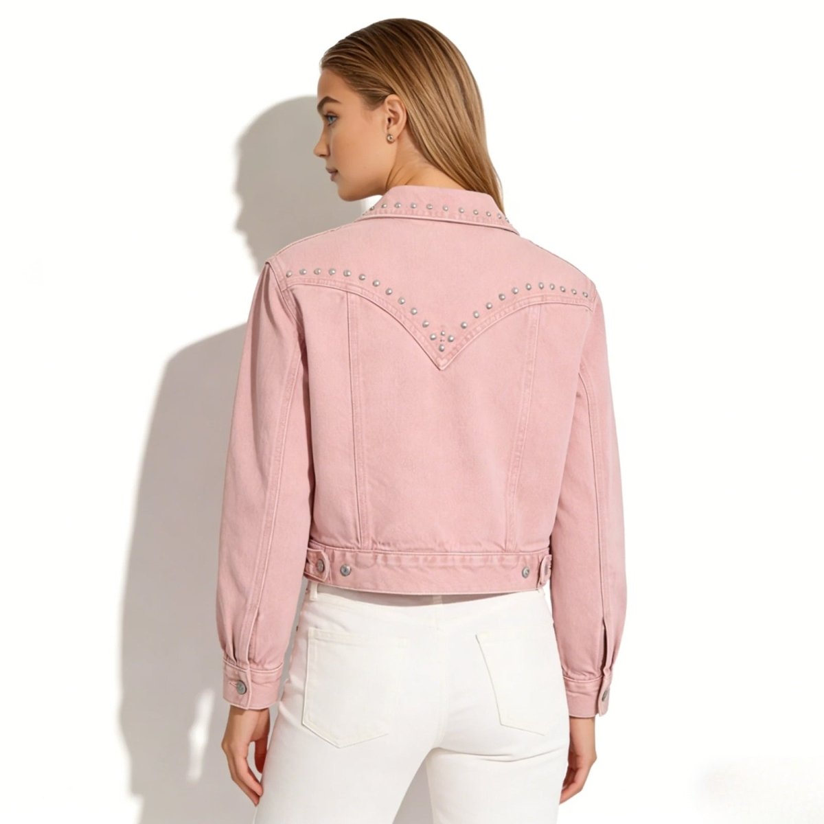 Back view of the Kouvr Fashion pink denim jacket, highlighting the silver stud detailing on the western-style yoke.