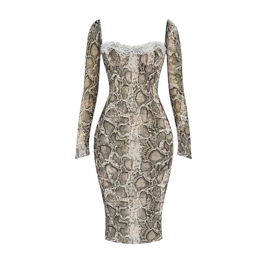 Kouvr Dress with snake print on a white background