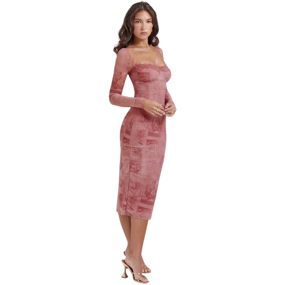 Woman wearing a pink Kouvr lace dress on a white background