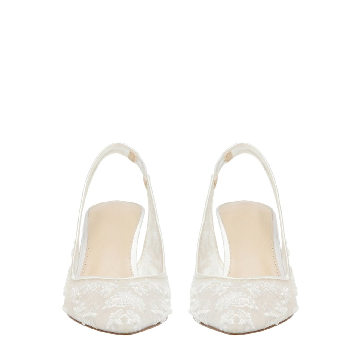 Pair of white Kouvr lace shoes on a white background