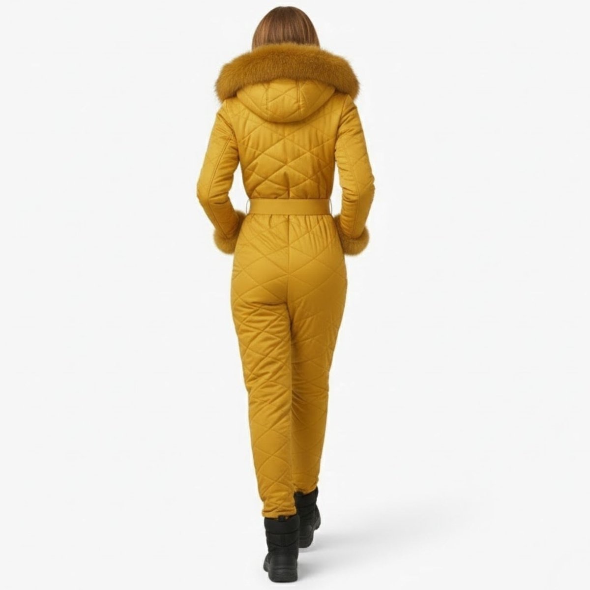 Back view of a model in the Kouvr Fashion yellow one-piece snowsuit, highlighting the quilted pattern and belted waist.
