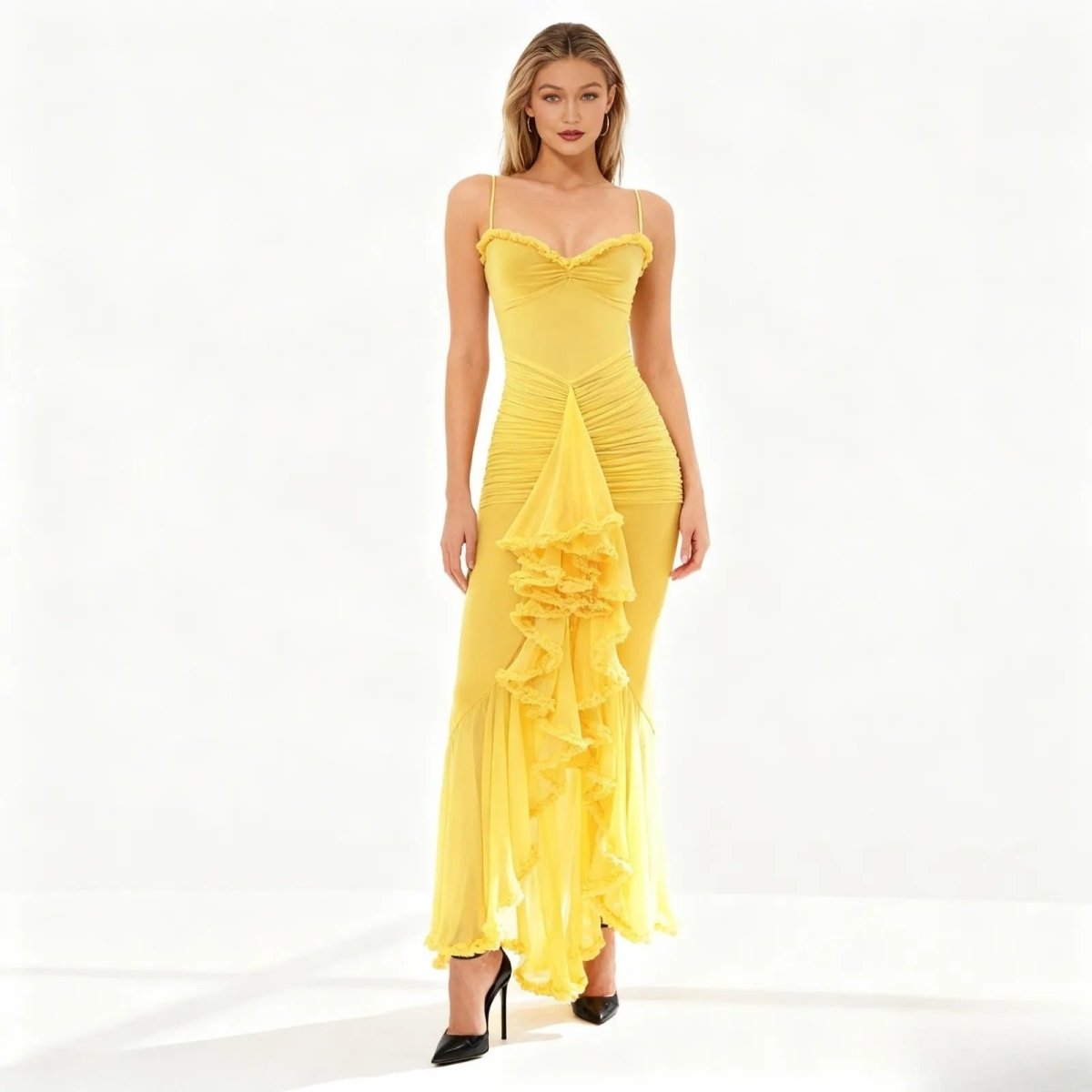 Woman wearing a yellow kouvr evening gown on a white background