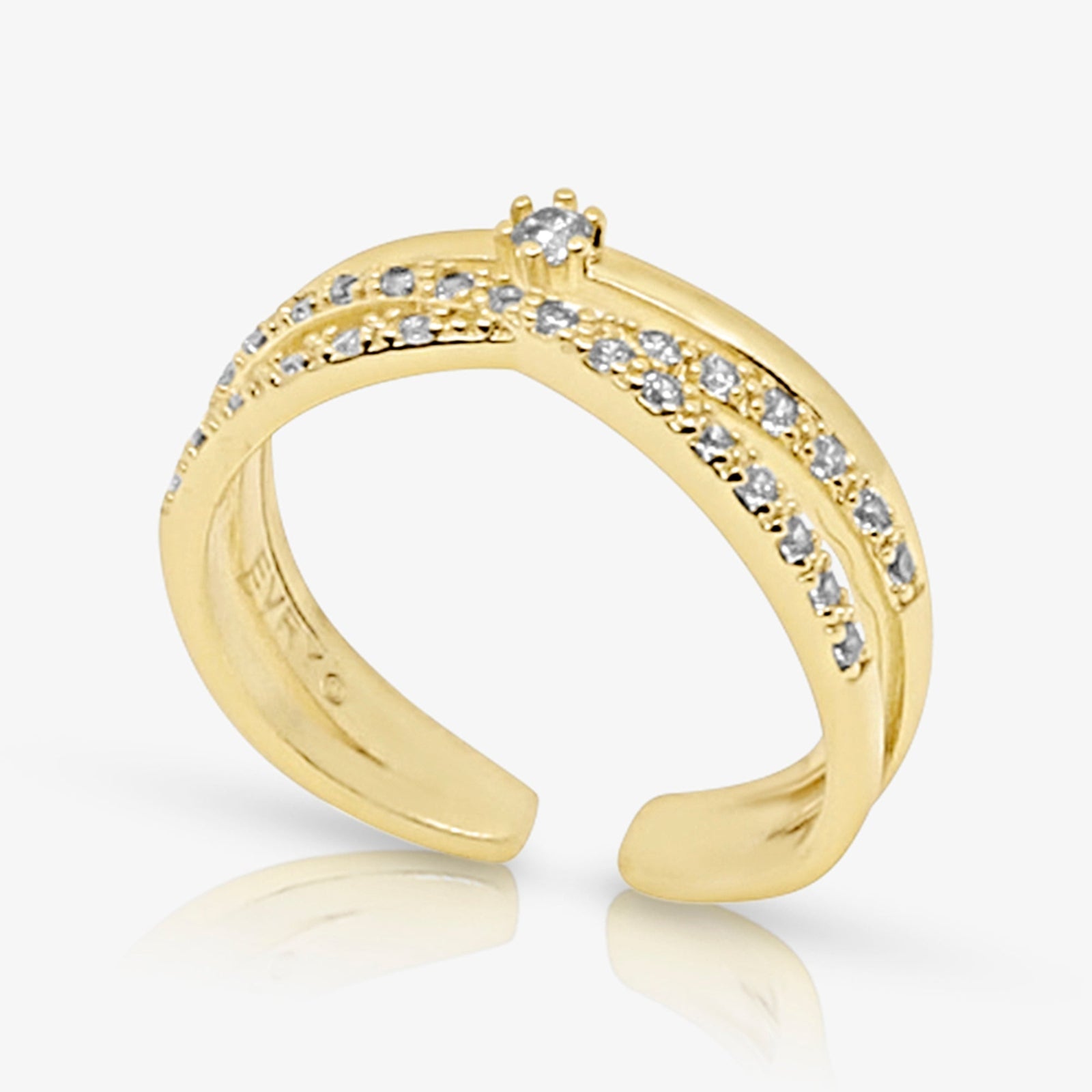 Gold kouvr ring with diamond accents on a white background