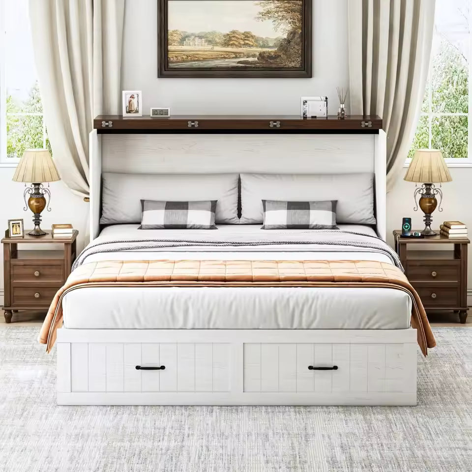Large bottom wooden storage drawer of a white cabinet bed pulled open showing folded pillows and extra guest linens