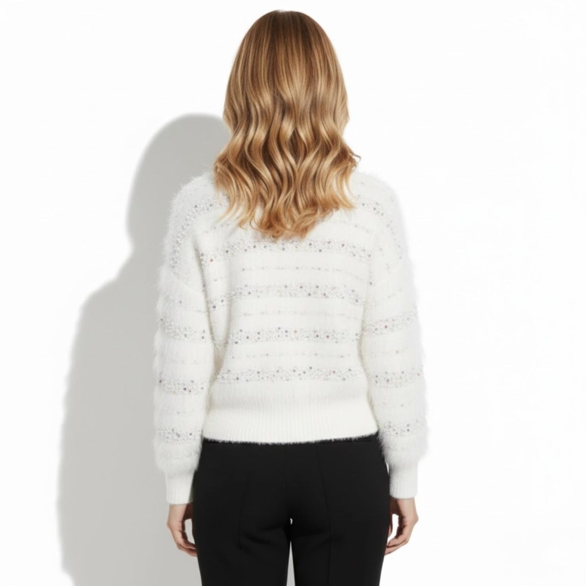 Back view of the Kouvr white confetti knit cardigan showcasing the horizontal textured pattern.