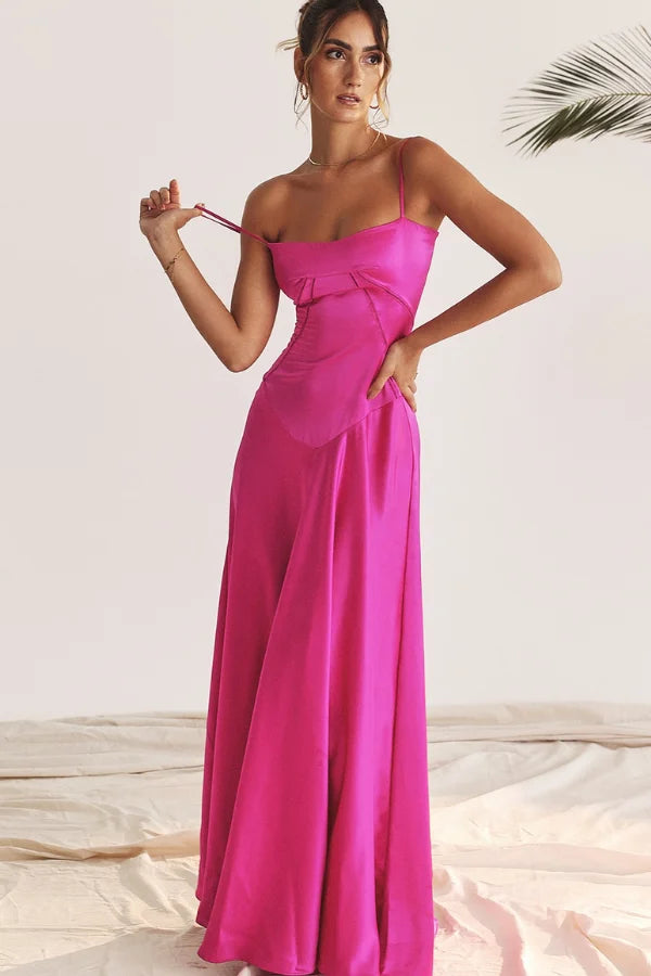 Model wearing the Kouvr Gabriella Gown in Fuchsia Satin with a lace-up corset back.