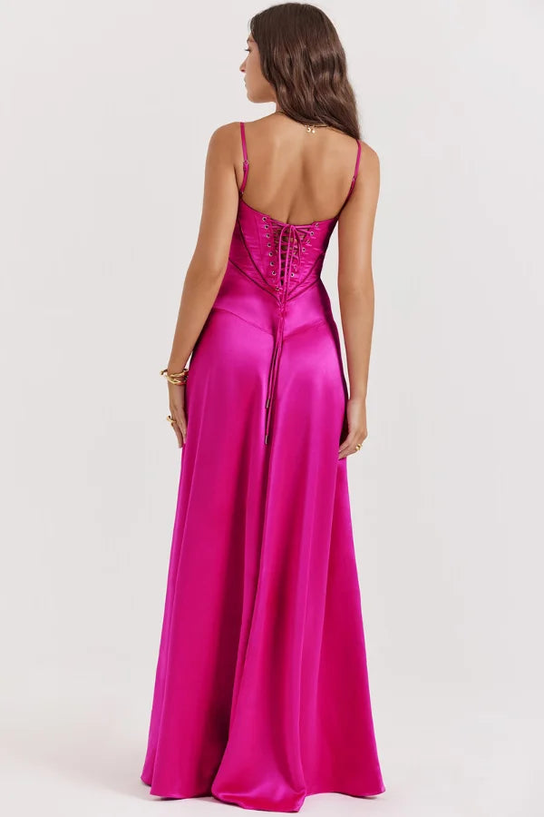Model wearing the Kouvr Gabriella Gown in Fuchsia Satin with a lace-up corset back.
