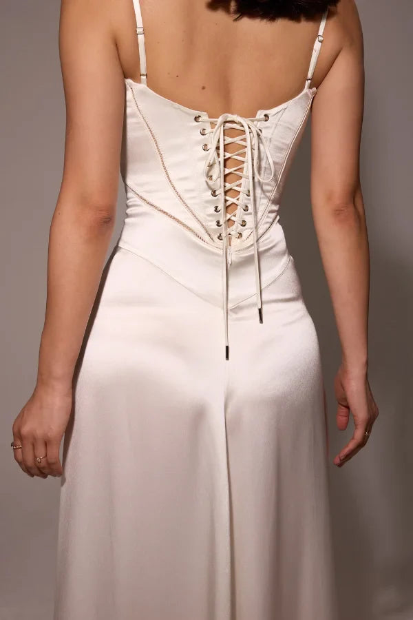 Model wearing the Kouvr Gabriella ivory silk corset back bridal gown.