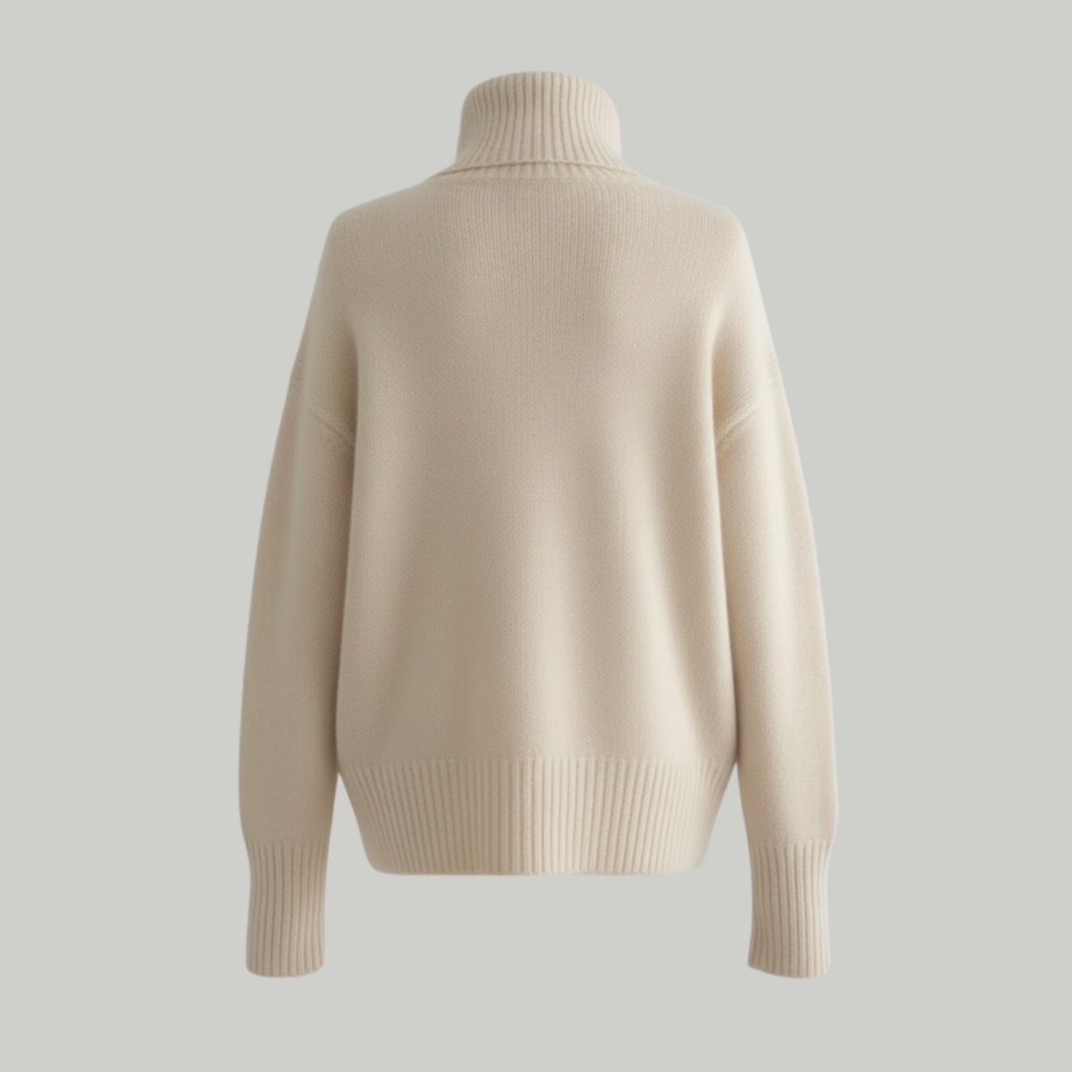 Back view studio product shot of the Kouvr gloria cashmere turtleneck pullover, showing the ribbed hem and collar detail.