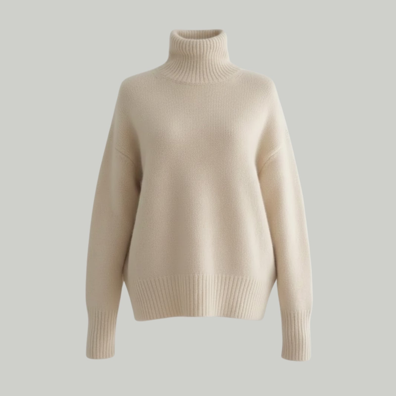 Studio product shot of the Kouvr gloria cashmere turtleneck pullover in beige on a grey background.