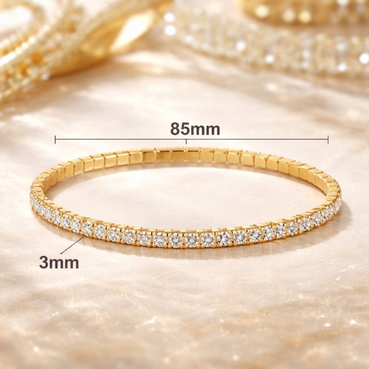 Kouvr gold tennis bracelet with measurement overlay showing 85mm diameter and 3mm stone width.