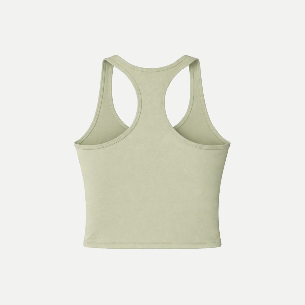 Flat lay back view of Kouvr high performance green racerback athletic tank top on a white background.