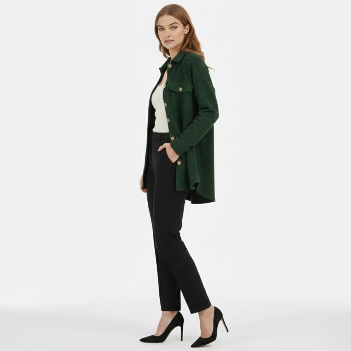 Side profile of a model wearing the green waffle knit shacket, showing its longline silhouette and high-low hem.