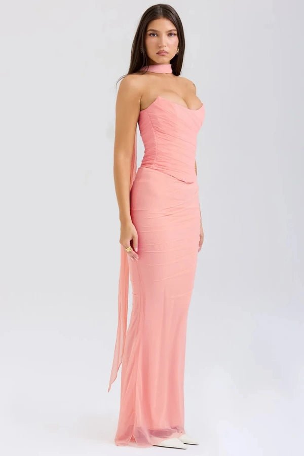 Side profile of the Hailey pink strapless gown showing the ruched mesh fabric, corset bodice, and mermaid silhouette.