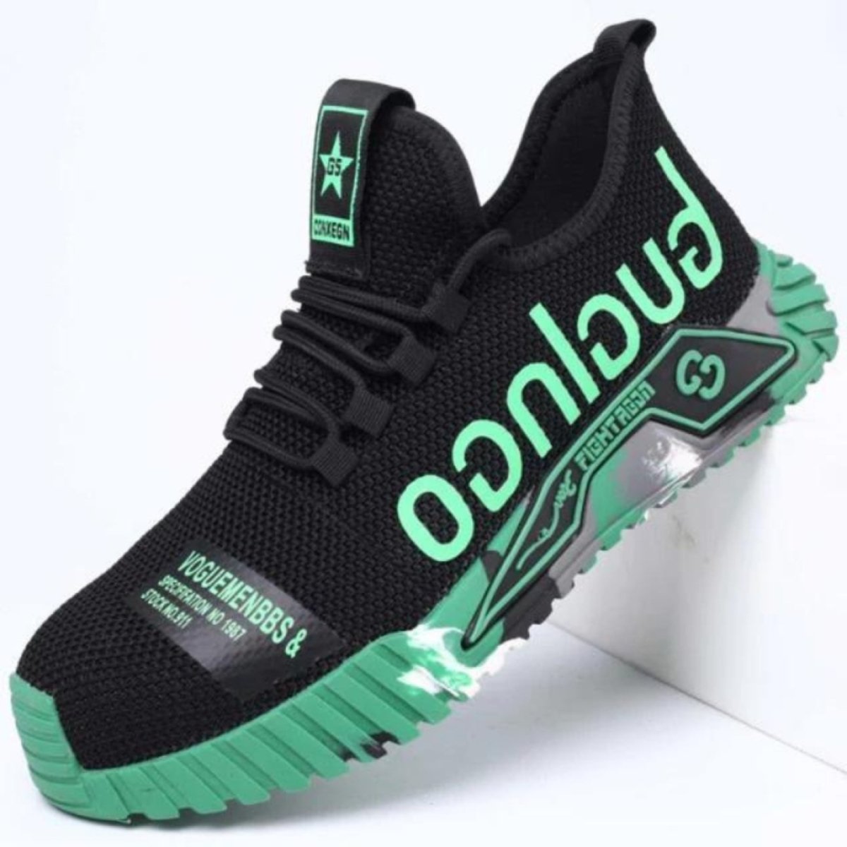 Black and green Kouvr sneaker with branding on a white background