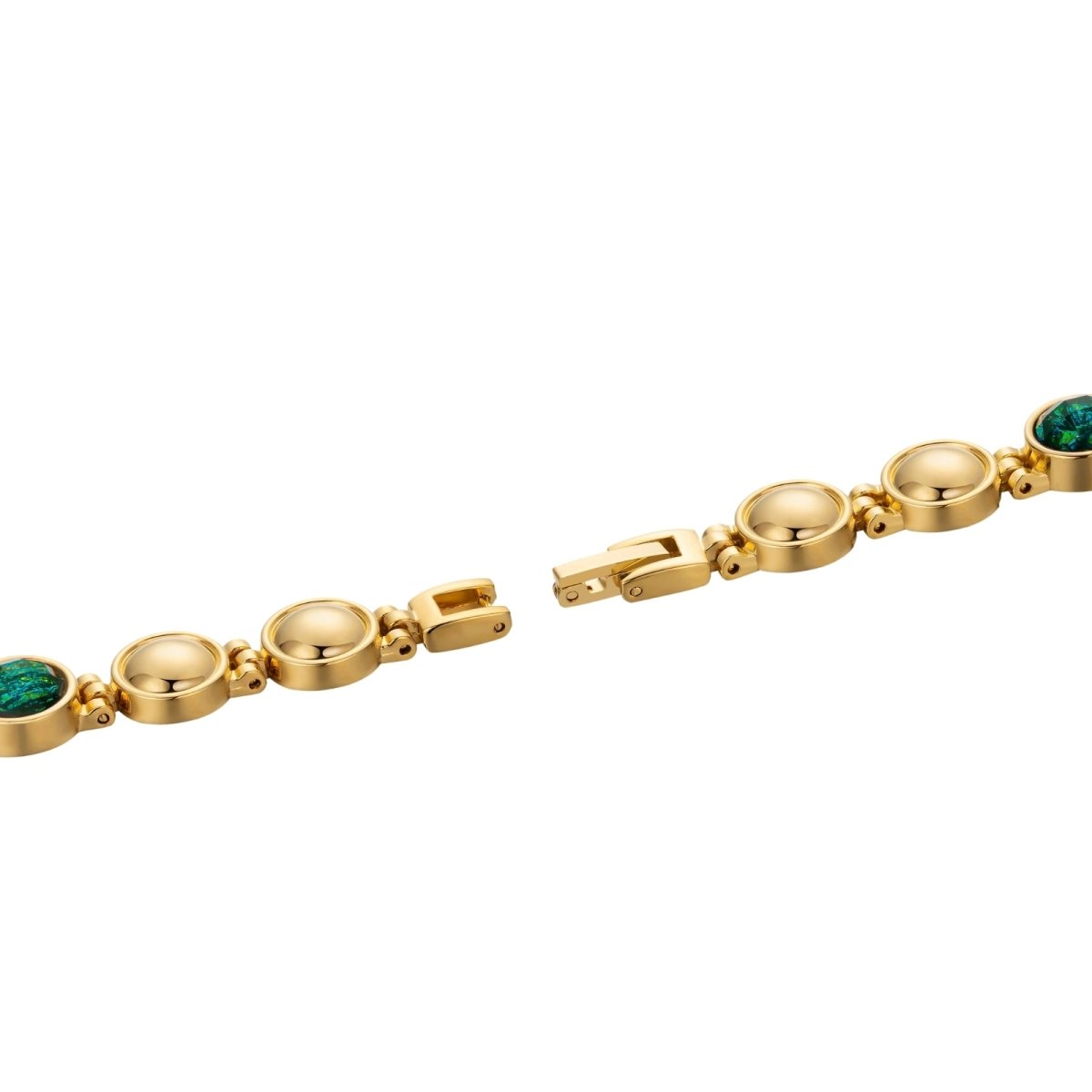 Gold kouvr bracelet with green gemstones on a white background