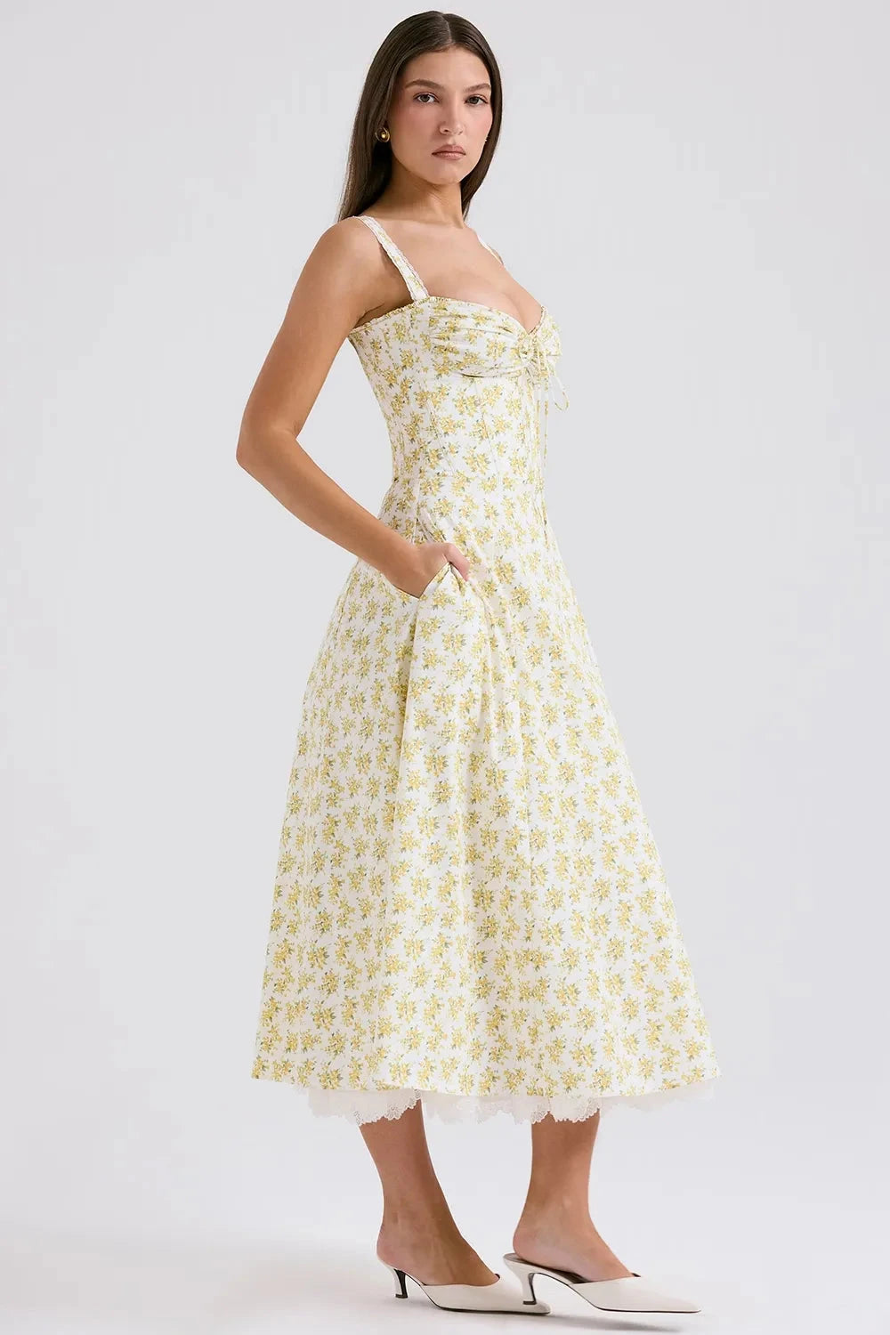 Kouvr's Helena yellow floral vintage-inspired midi dress with sweetheart neckline and pockets
