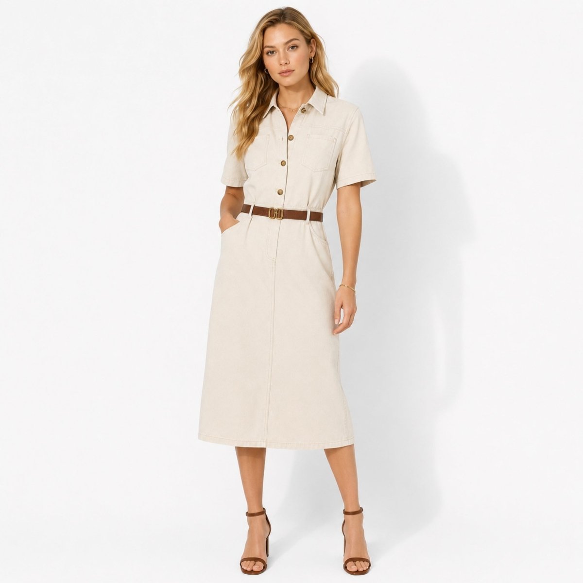 Woman wearing Kouvr ivory short sleeve utility midi shirt dress with brown belt facing forward.