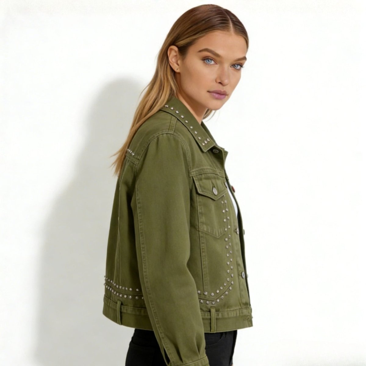 Side profile of a model in the army green studded trucker jacket by Kouvr Fashion, highlighting the sleeve and body silhouette.