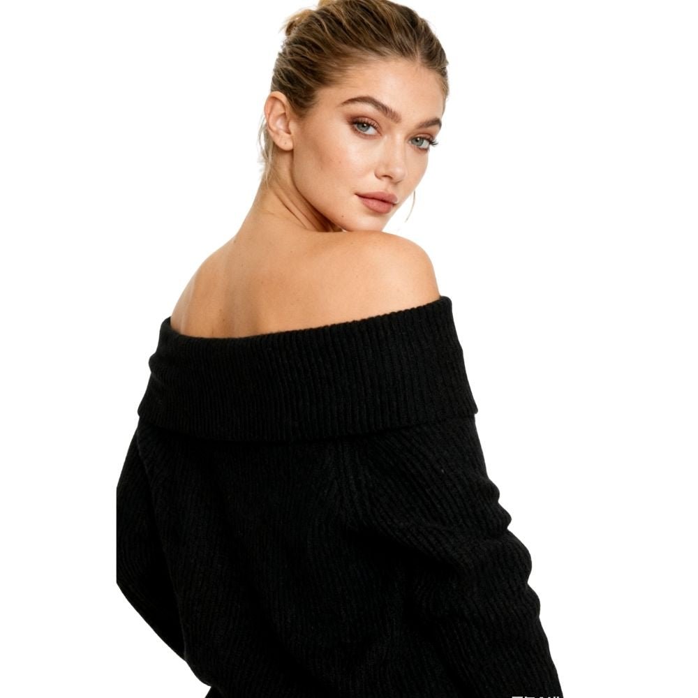 Woman wearing a black kouvr off-shoulder sweater on a white background