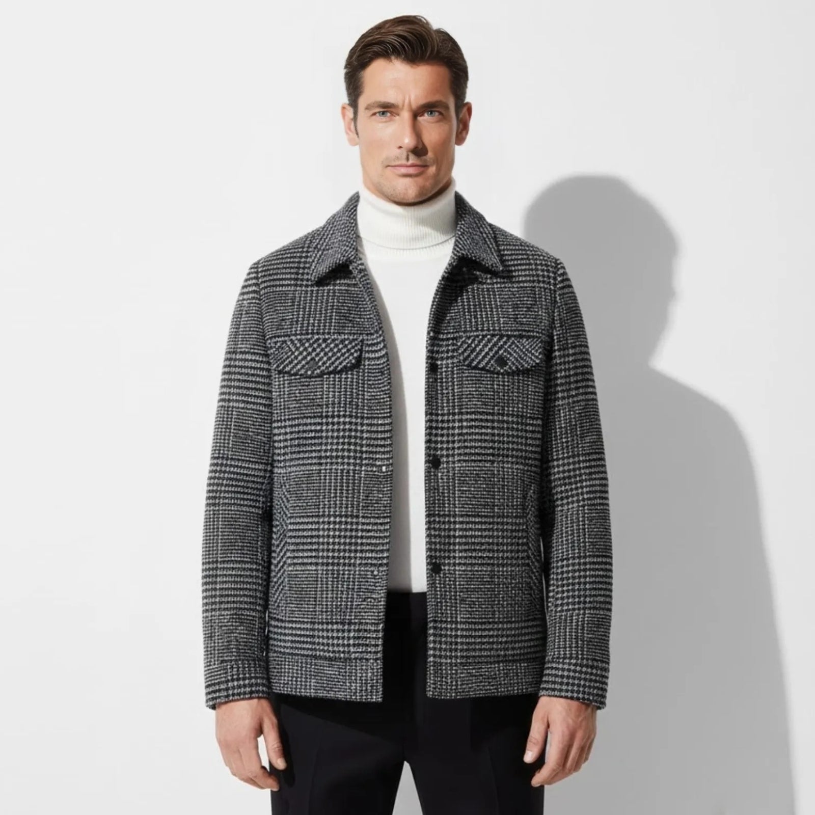 Model wearing the Kouvr Kensington men's Joseph Plaid wool-blend overshirt in gray layered over a white turtleneck.