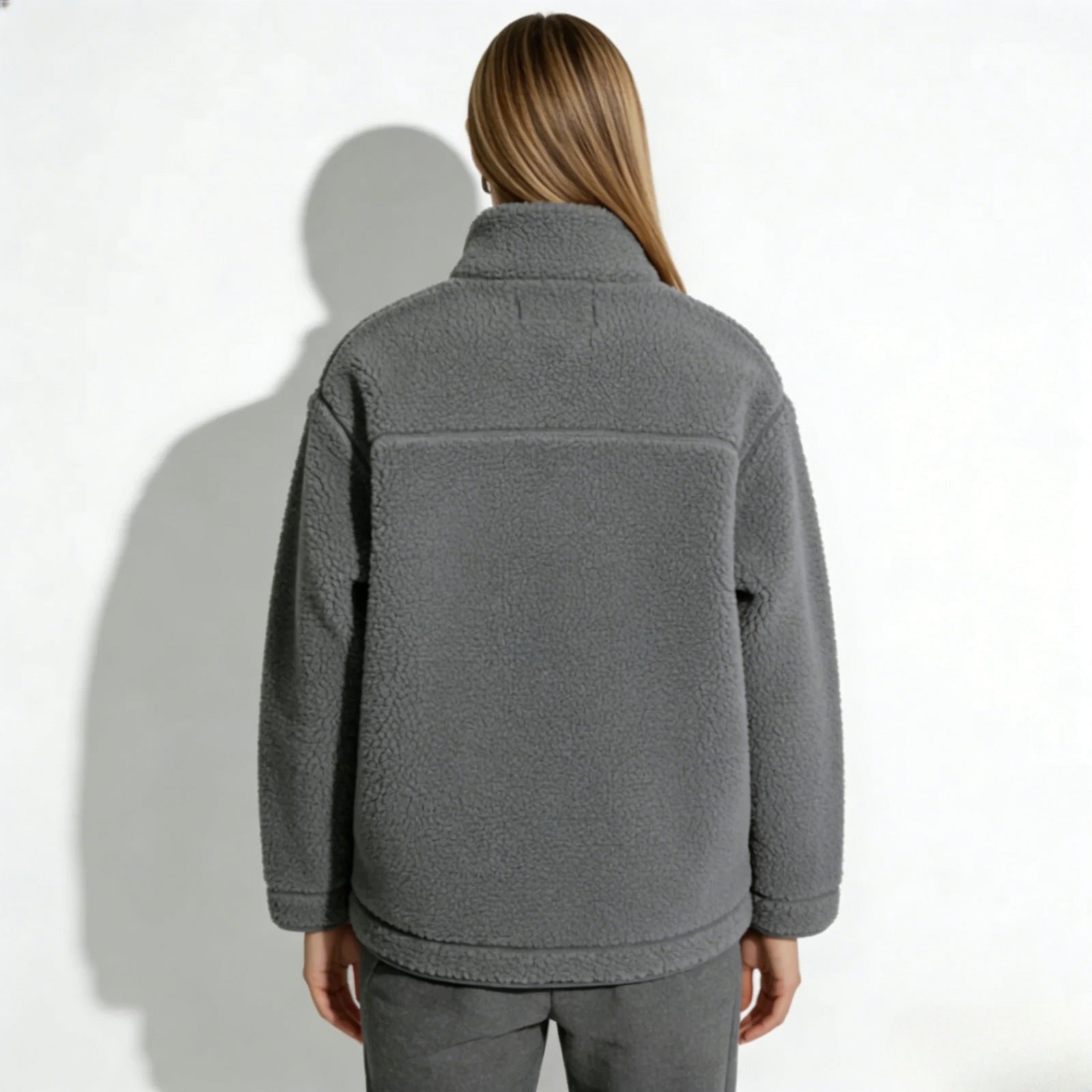 Back view of the Kouvr Fashion Julie fleece jacket gray, showing the clean lines and horizontal back yoke detail.