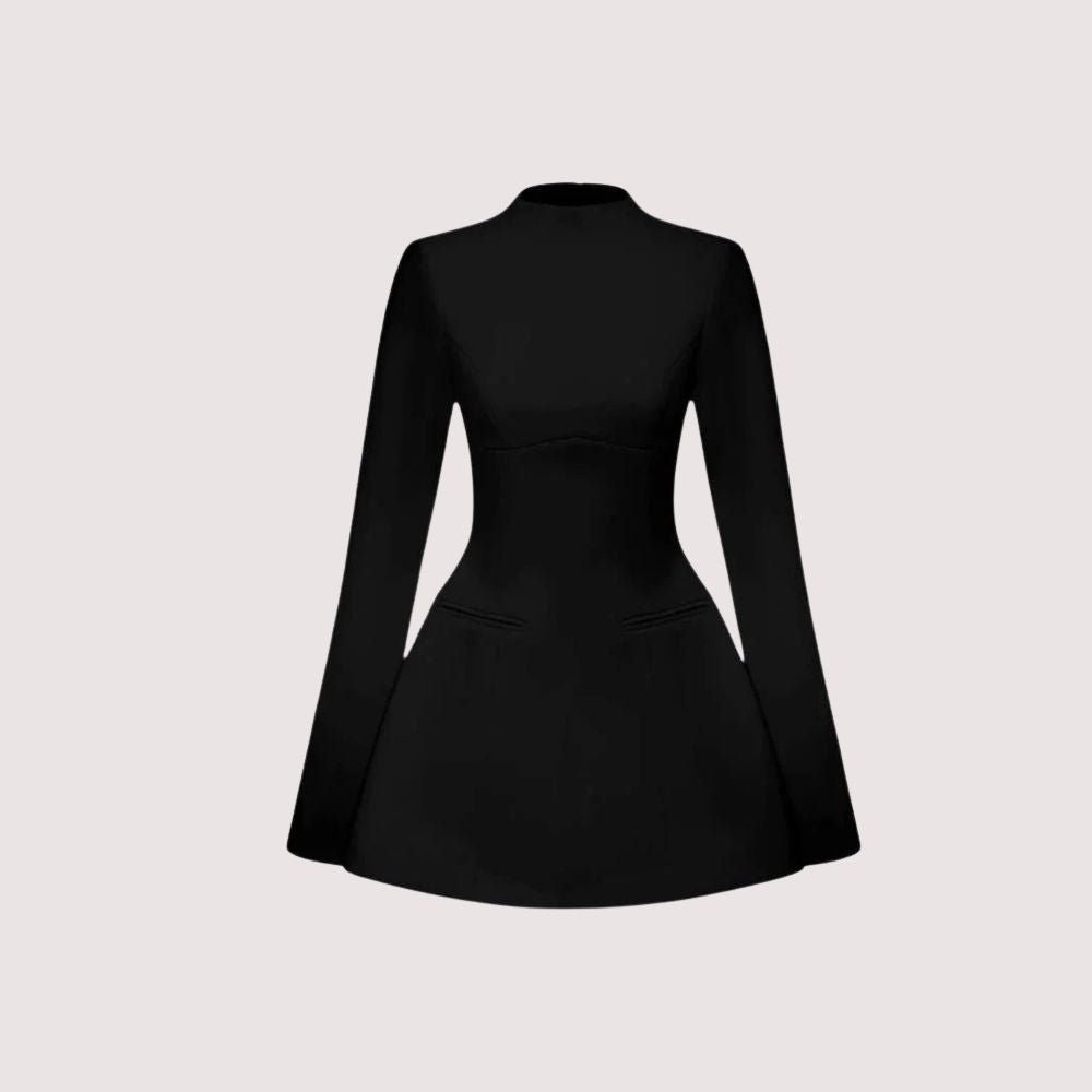 Woman wearing Kouvr Kaisha black long sleeve open-back mini dress in a stone archway