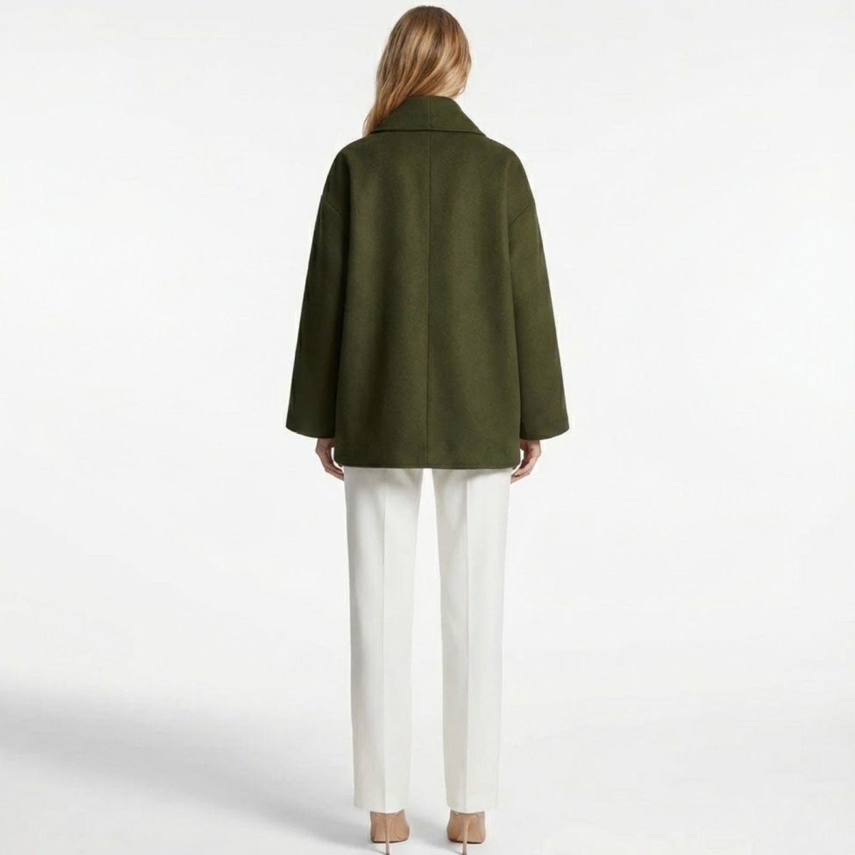 Back view of the Kouvr Katherine oversized wool coat in green, highlighting the clean lines and minimalist design.