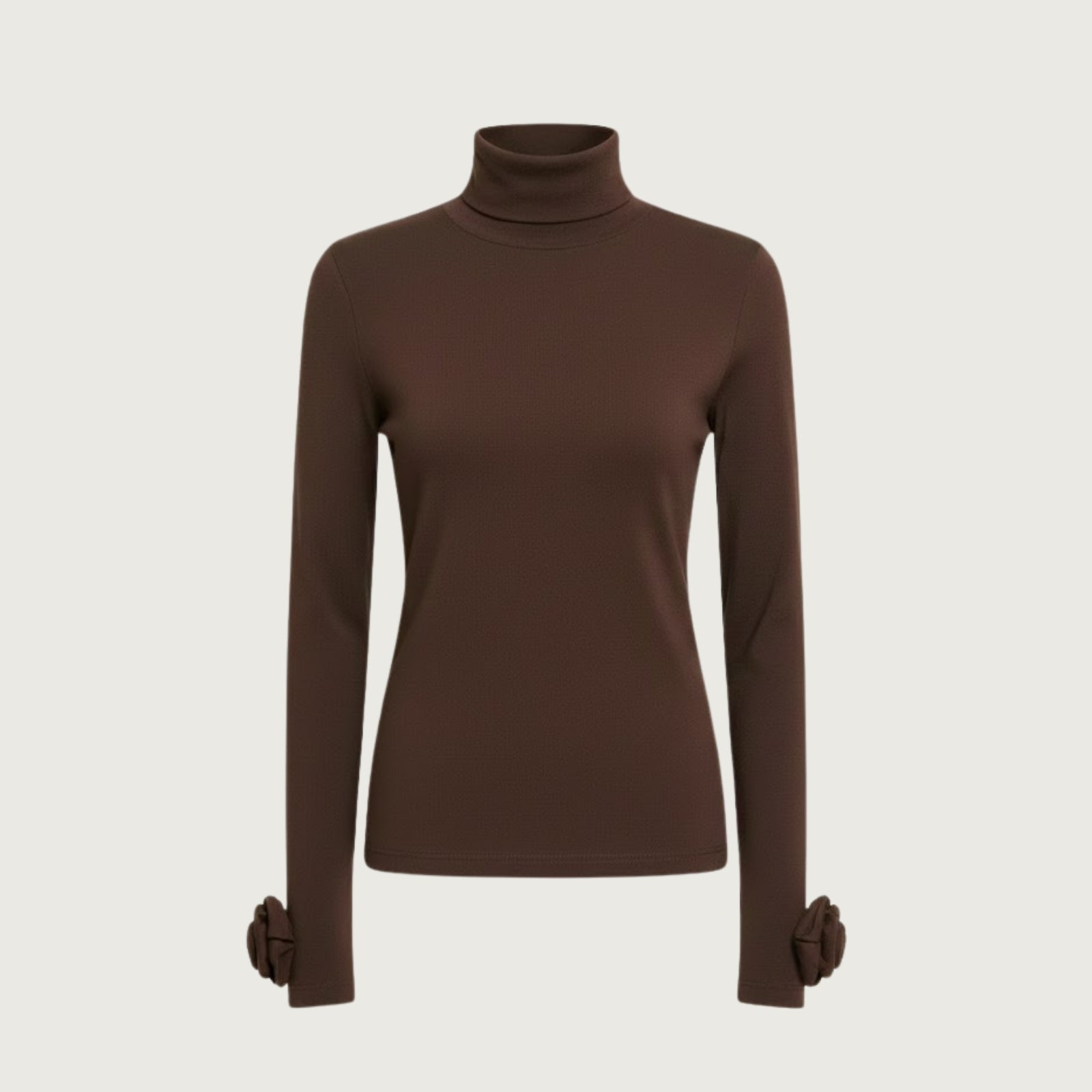 Product shot of the Kouvr Fashion brown turtleneck top laid flat, showing the full length and rosette cuffs.