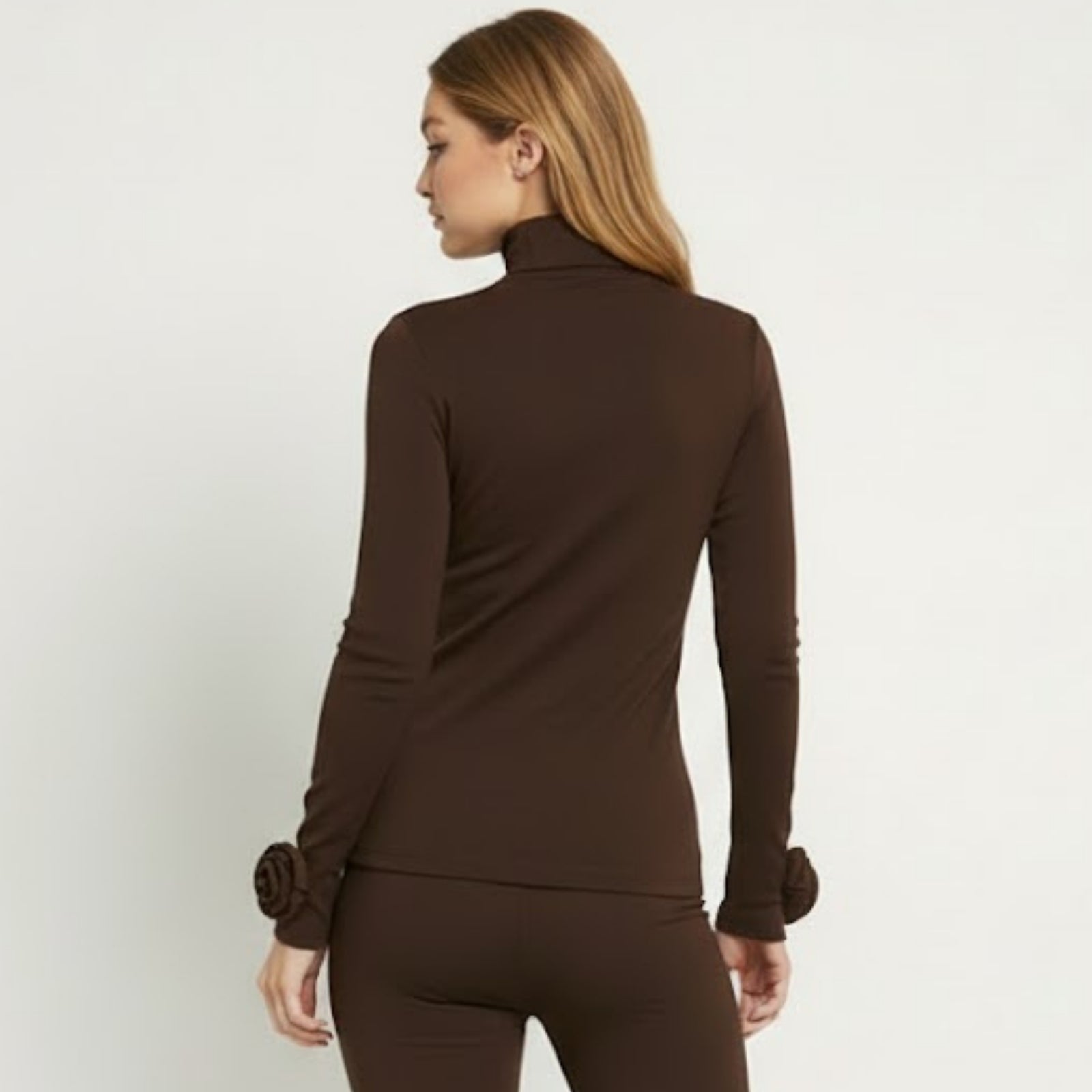 Back view of the Kouvr Fashion dark brown turtleneck top, highlighting the seamless construction and fit.