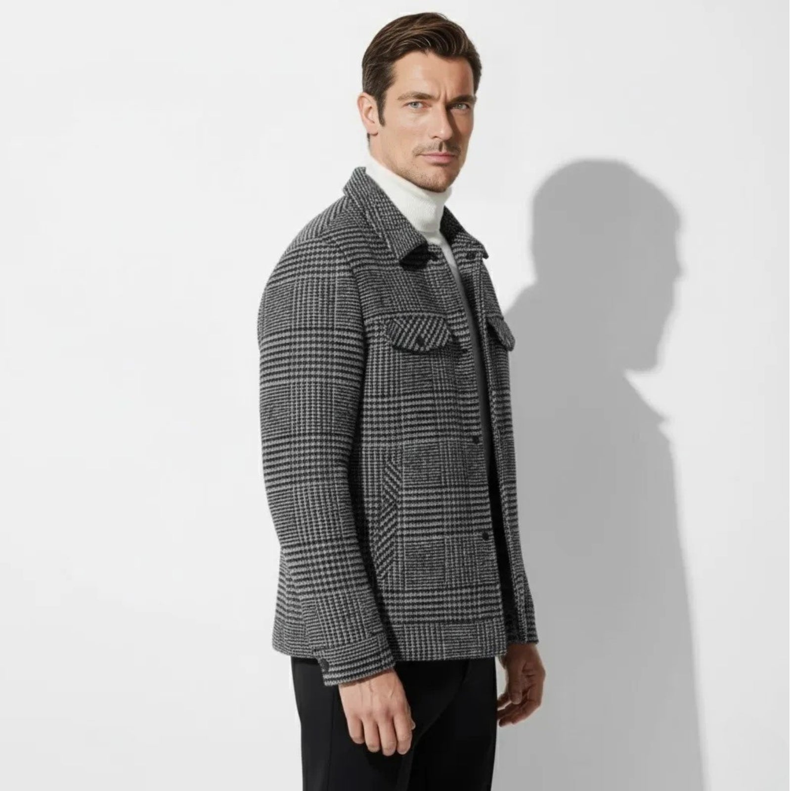 Side profile view of a man wearing the gray check Kouvr Kensington shacket, showing its structured fit and silhouette.