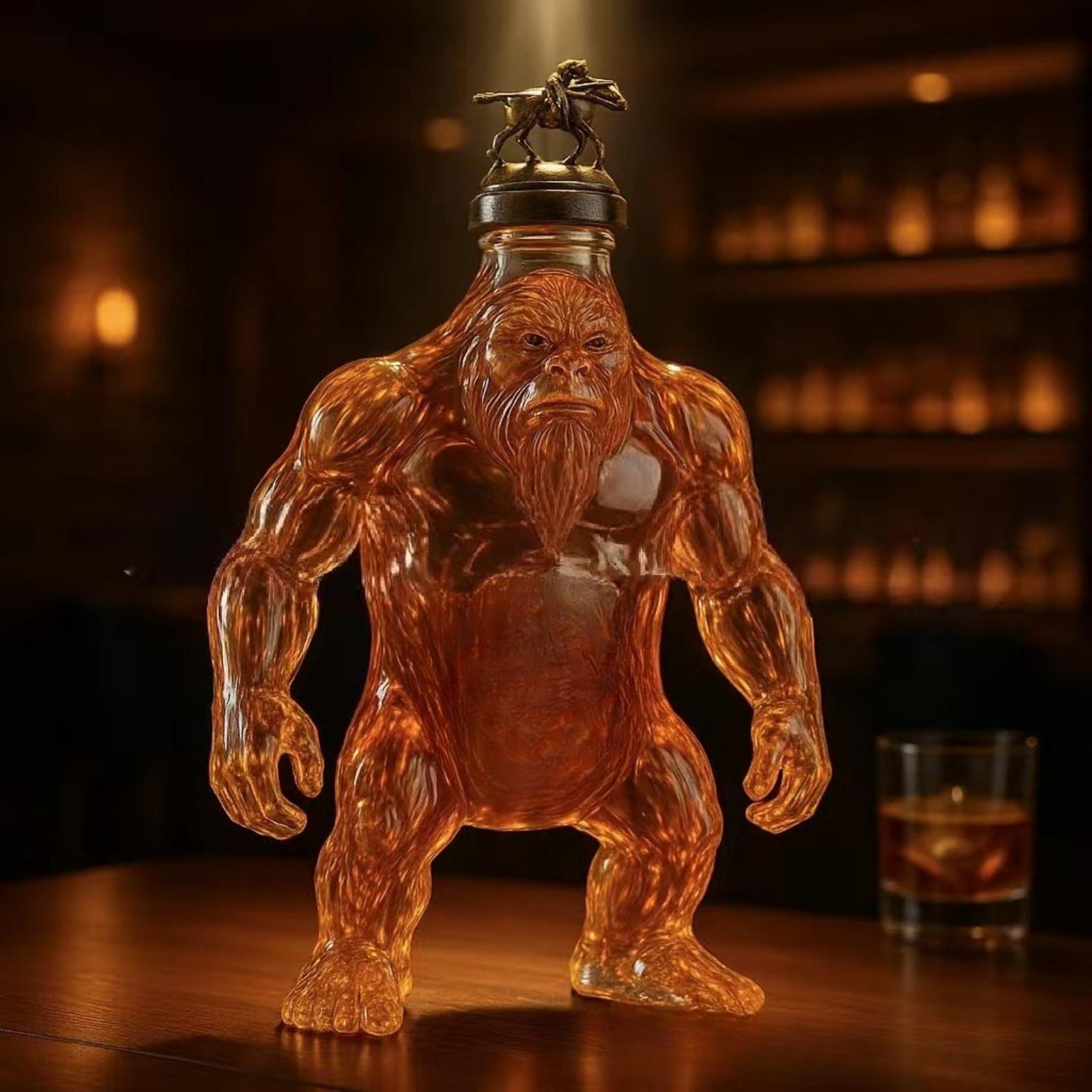 Front view of the Kouvr King Kong Whiskey Decanter, filled with amber liquid and standing on a wooden bar top.