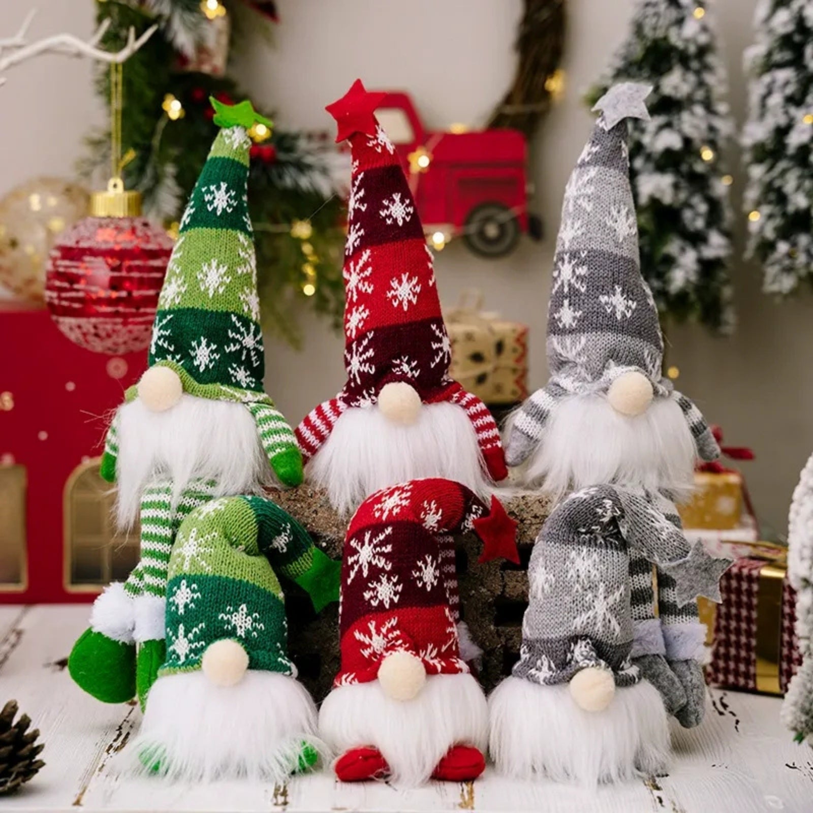 Detailed studio shot of six Kouvr Nordic Christmas gnomes, showcasing the intricate snowflake knit pattern and soft texture of their hats and beards. Gnomes are unlit to highlight craftsmanship.
