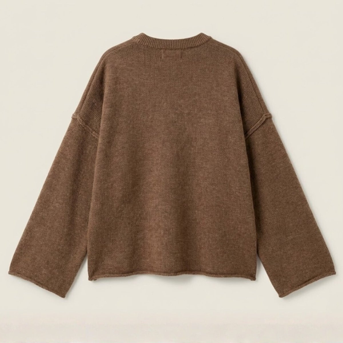 Back view flatlay of the oversized brown pullover sweater, showing the ribbed collar detail and overall shape.