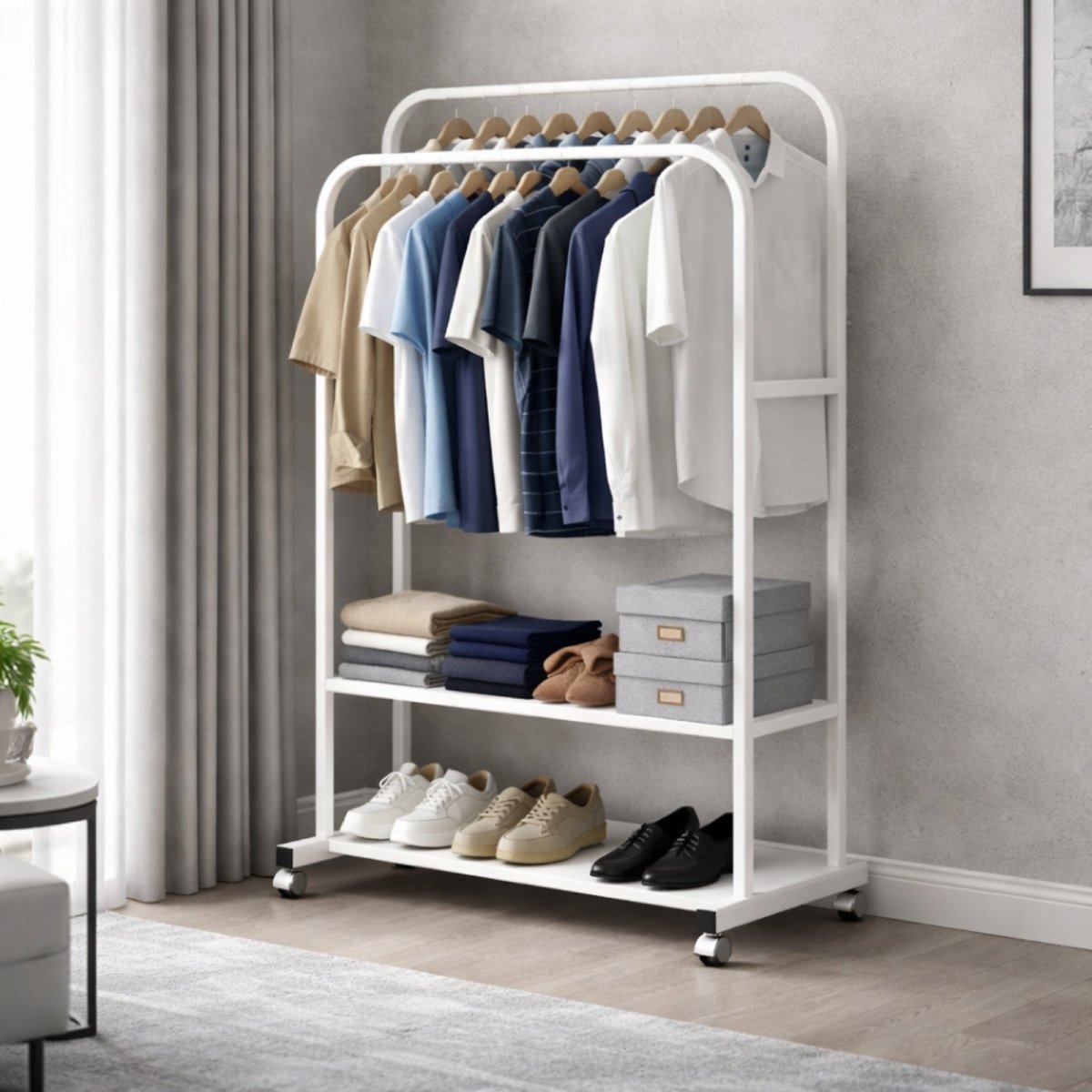 A white Kouvr rolling clothing rack demonstrating its full capacity with two rows of clothes, folded items, storage boxes, and multiple pairs of shoes.