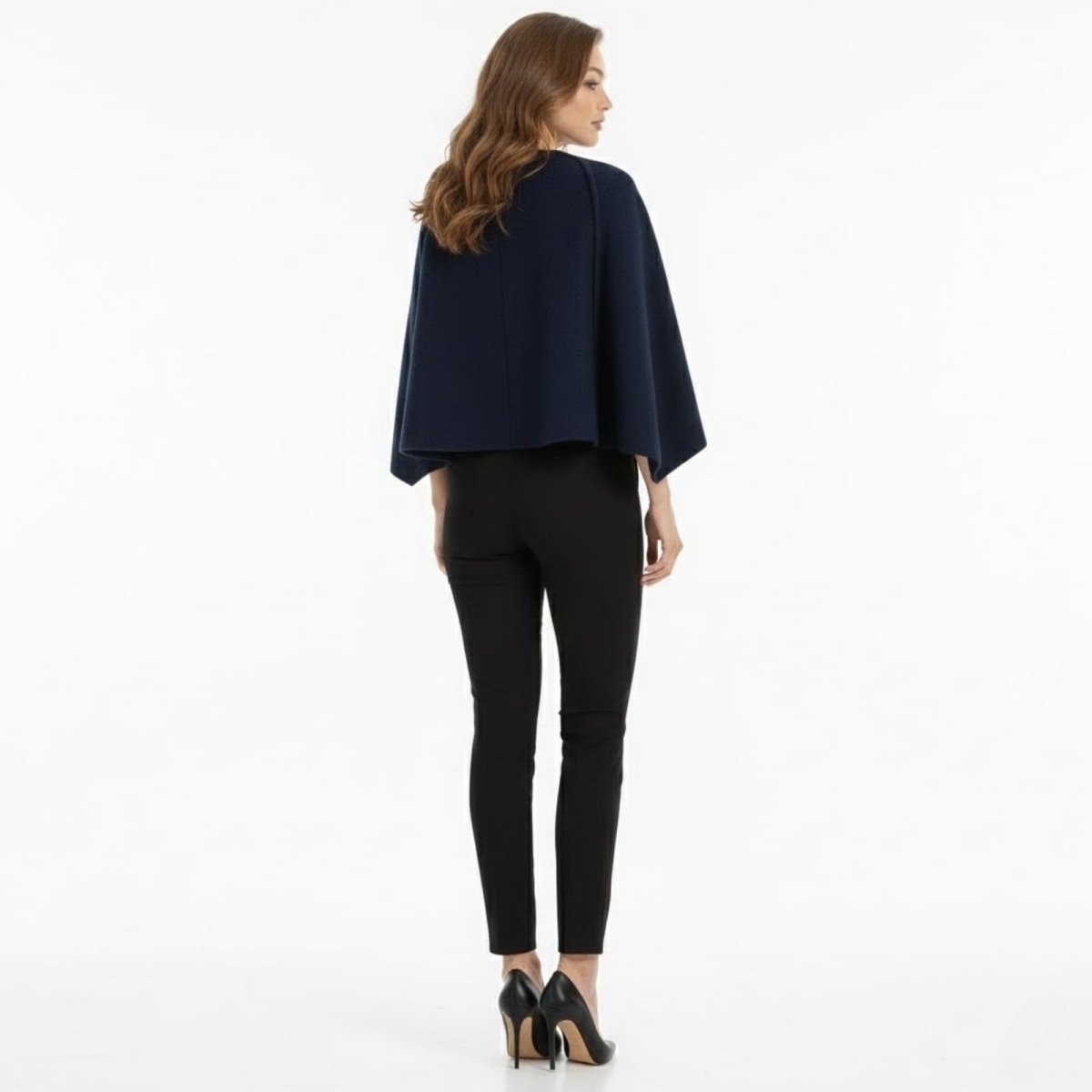 Back view of the Kouvr Laverne structured wool cape jacket in blue, highlighting the clean lines and minimalist design.