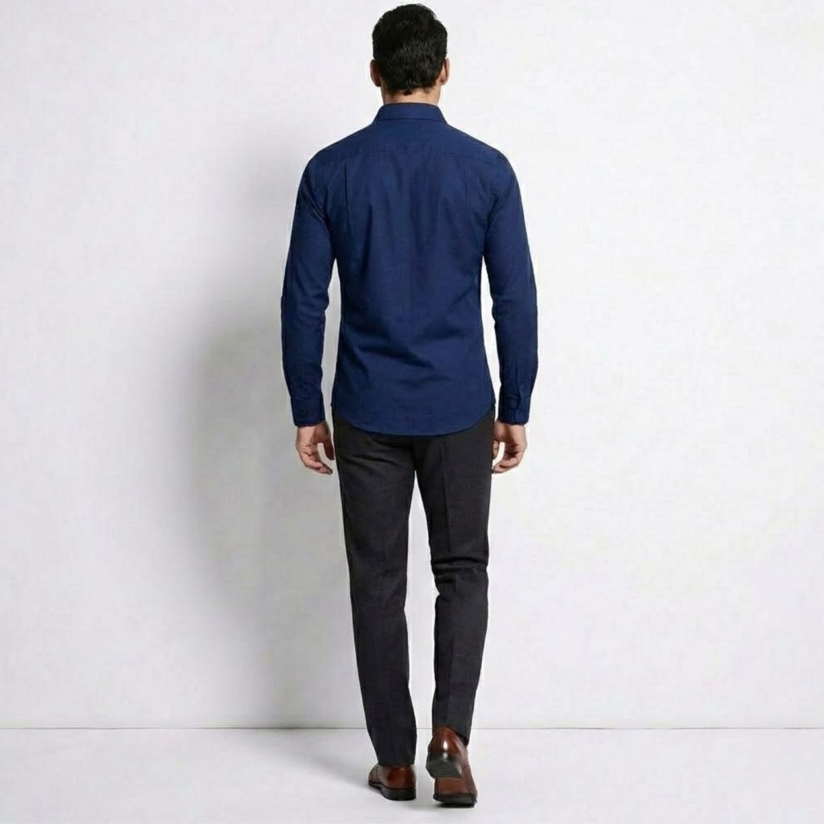 Back view of the Kouvr Leland blue formal dress shirt, highlighting the tailored fit and shoulder yoke.