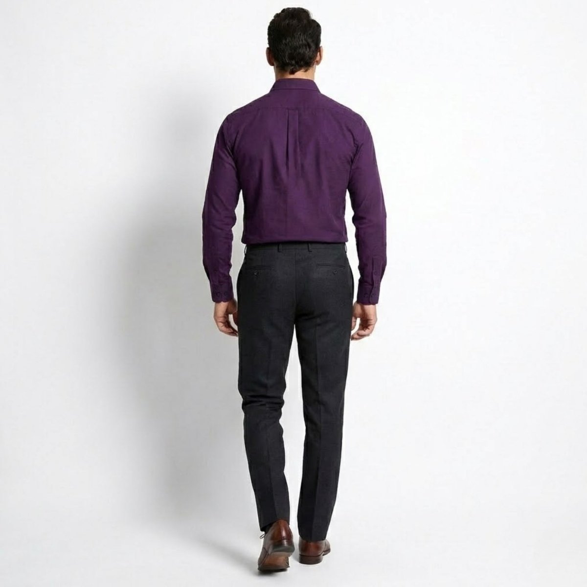 Back view of a male model wearing the Kouvr Leland purple shirt, showing the tailored fit and back yoke detail.