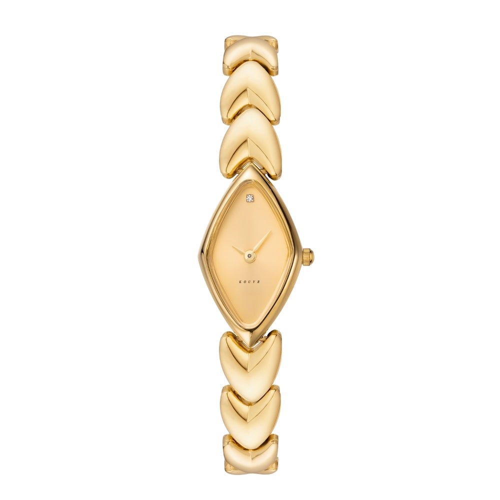 Gold Kouvr watch with a decorative band on a white background