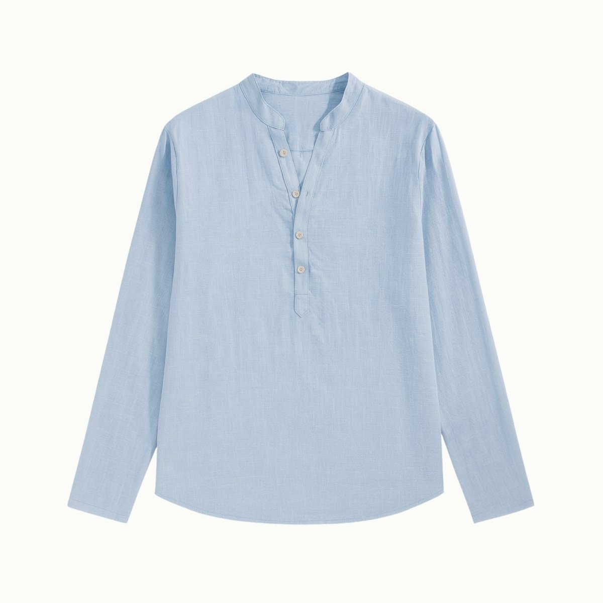 Flat lay of the Kouvr light blue linen Roby shirt, detailing the band collar, mother-of-pearl buttons, and fabric texture.